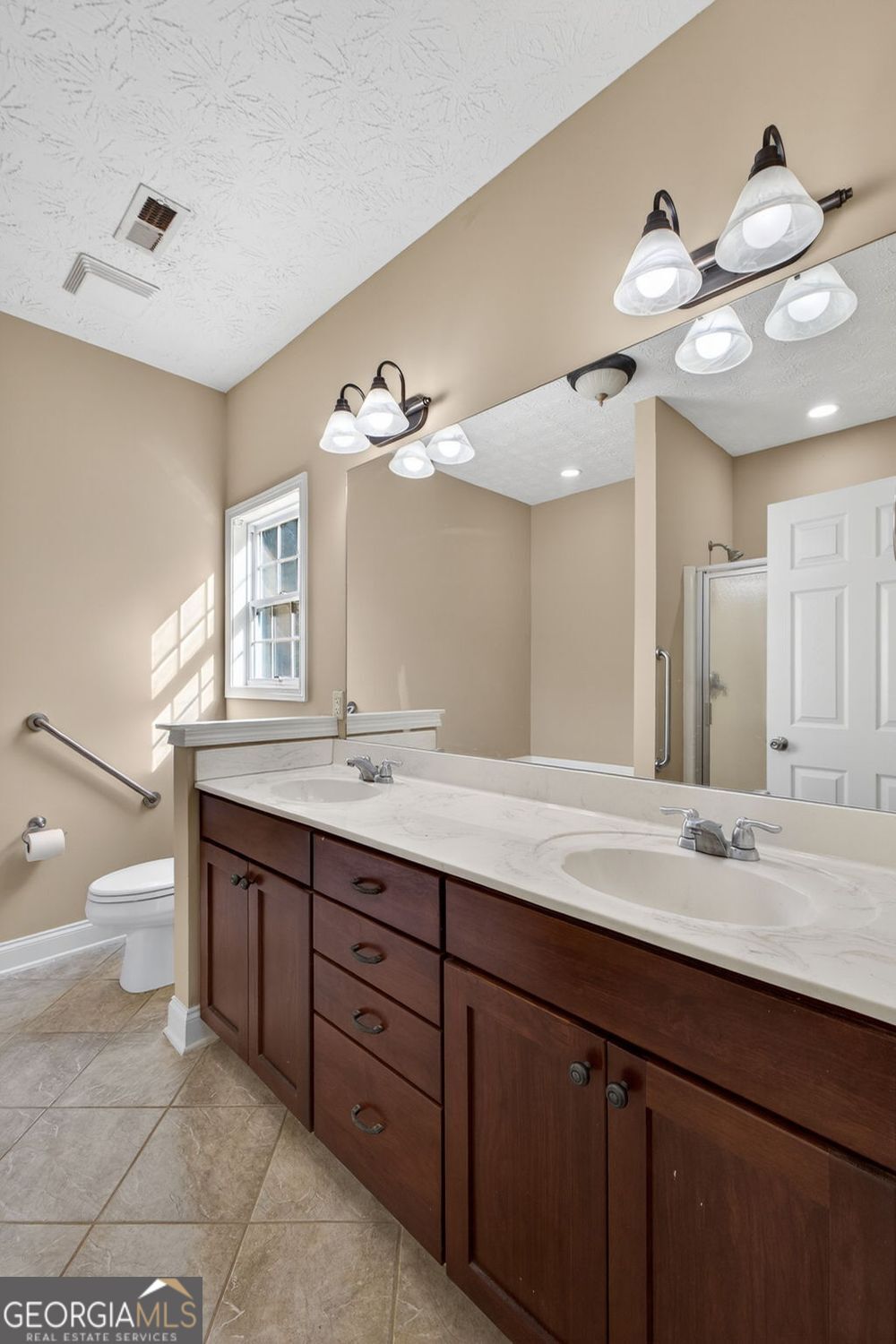 206 Jack Maddox Bridge Road Jackson, GA 30233 - Photo 21 of 38 a bathroom with a double vanity sink and a mirror