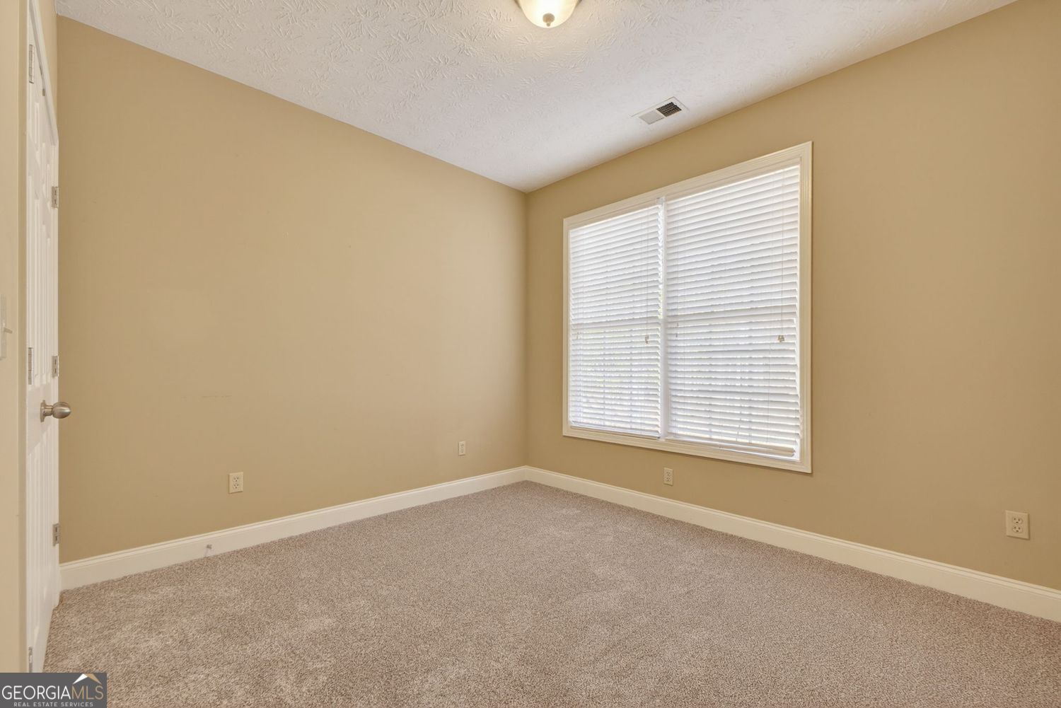 206 Jack Maddox Bridge Road Jackson, GA 30233 - Photo 23 of 38 an empty room with a window