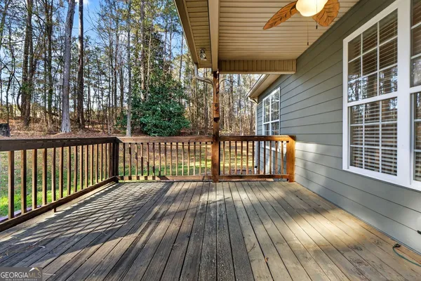 a view of a wooden deck with a yard