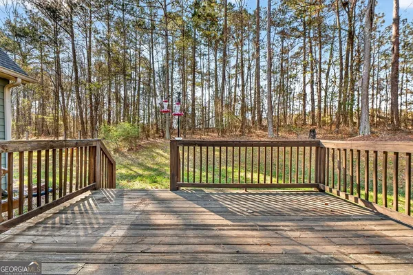 a view of a balcony with wooden floor