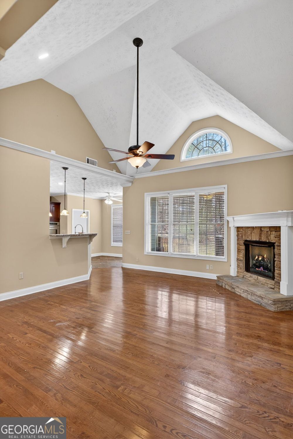 206 Jack Maddox Bridge Road Jackson, GA 30233 - Photo 6 of 38 a view of an empty room with wooden floor fireplace and a window