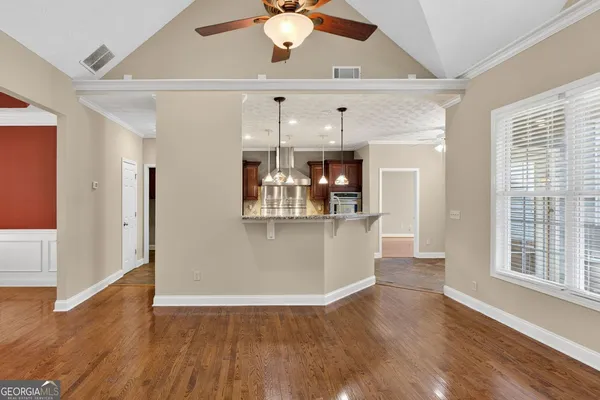 a view of a kitchen with a dishwasher cabinets and a large window