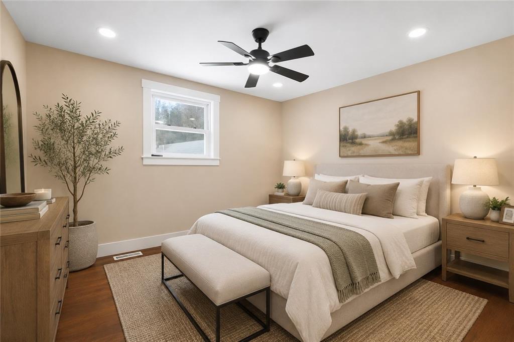 933 Boyce Road Bridgeville, PA 15017 - Photo 15 of 36 a bedroom with a large bed and a chandelier