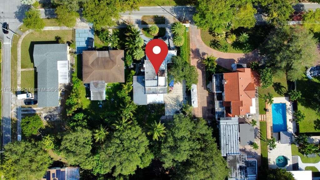 12820 Northeast 4th Avenue North Miami, FL 33161 - Photo 4 of 7 an aerial view of multi story residential apartment building with yard and sign board