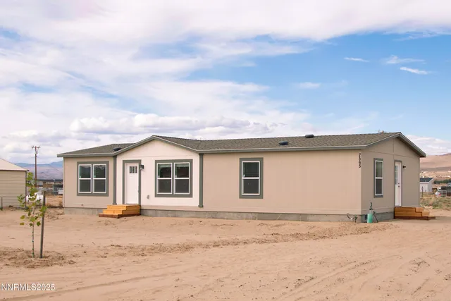 an aerial view of residential house with beach
