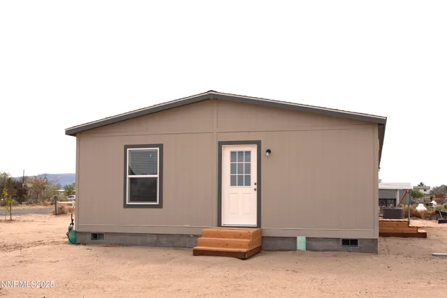 a front view of a house with a patio