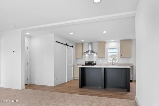 a kitchen with stainless steel appliances a sink stove and refrigerator