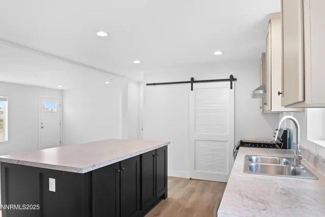 a kitchen with a sink and refrigerator