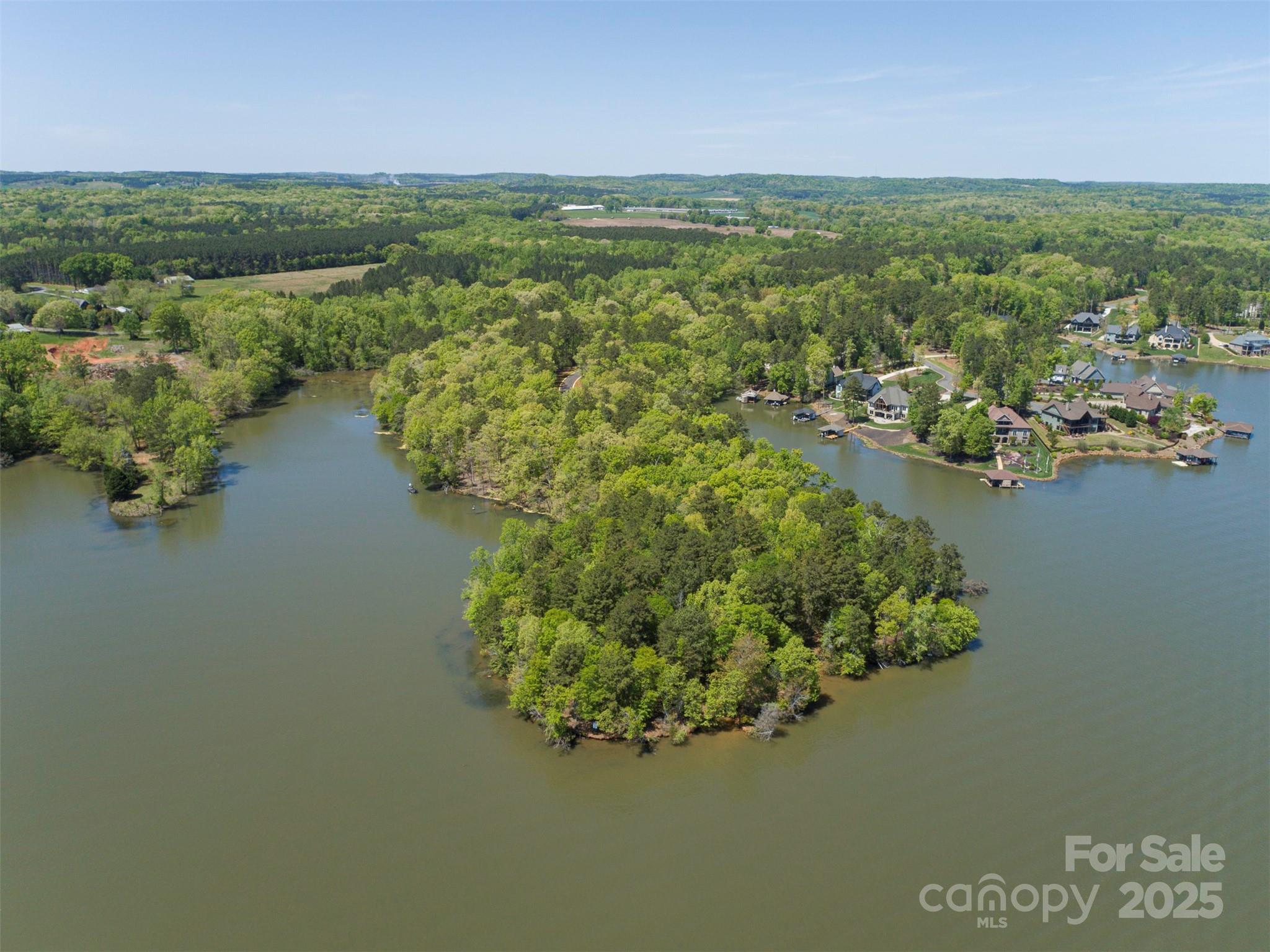 1079 Edgewater Drive, Unit NOTTINGHAM Albemarle, NC 28001 - Photo 25 of 27 a view of a lake with houses