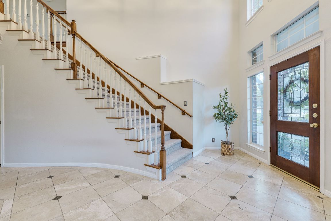 10701 Redmond Road Austin, TX 78739 - Photo 11 of 39 a view of entryway and hall with a floor to ceiling window