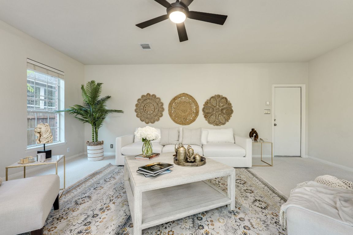 10701 Redmond Road Austin, TX 78739 - Photo 21 of 39 a living room with furniture and a large window
