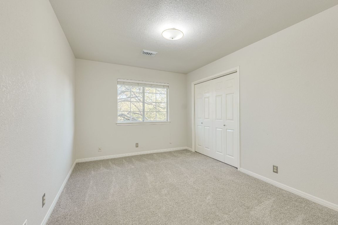 10701 Redmond Road Austin, TX 78739 - Photo 33 of 39 an empty room with windows