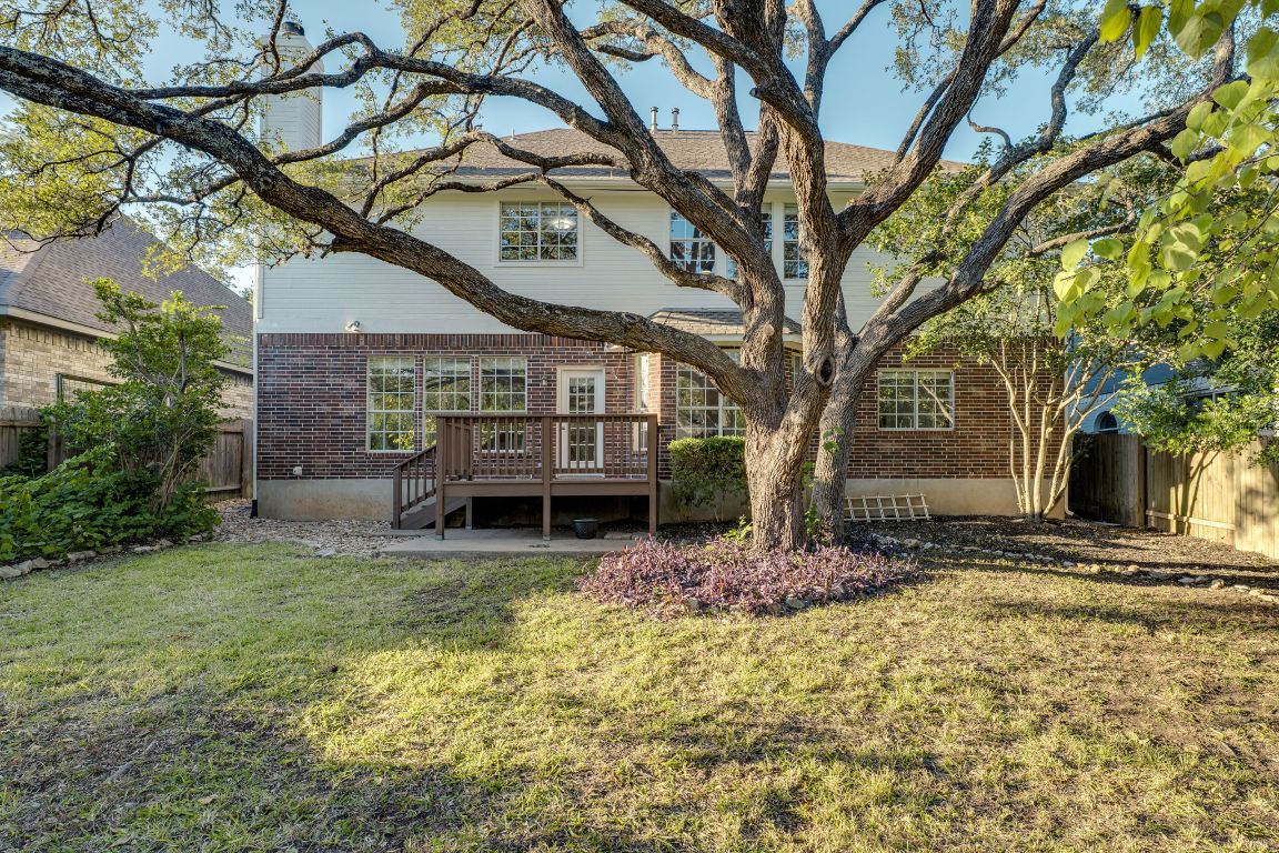 10701 Redmond Road Austin, TX 78739 - Photo 37 of 39 a view of a house with a tree front of house
