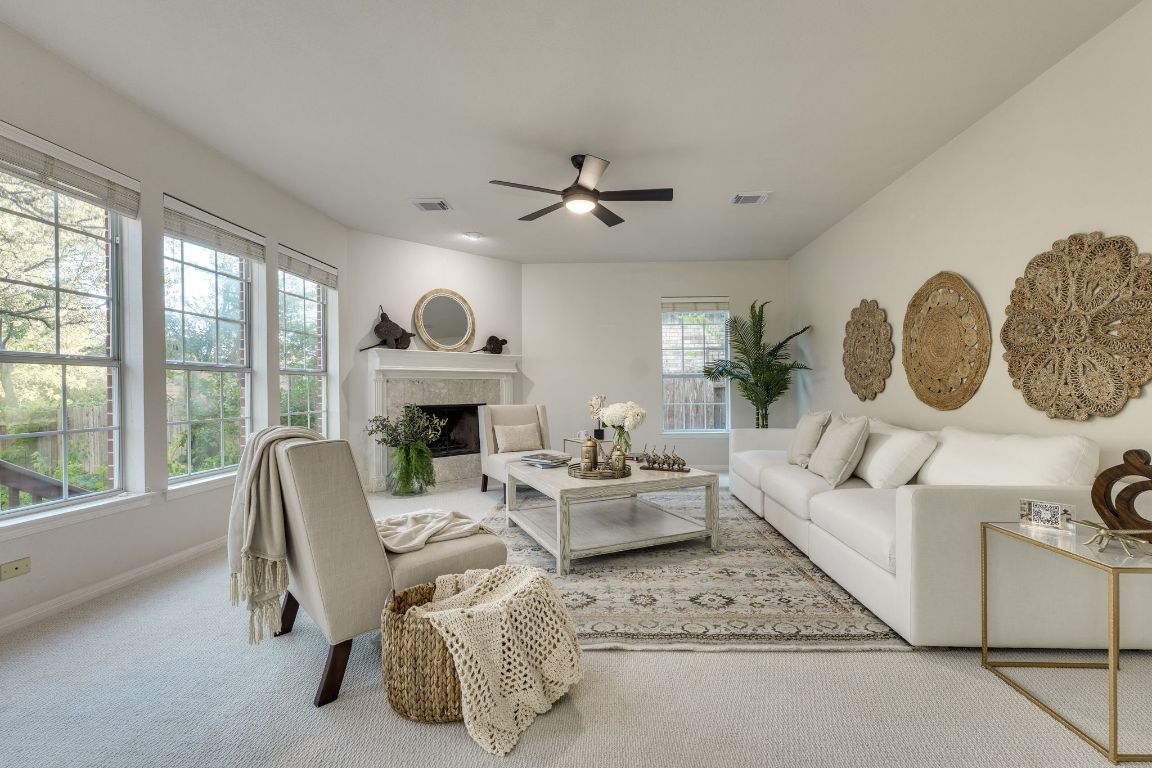 10701 Redmond Road Austin, TX 78739 - Photo 4 of 39 a living room with furniture fireplace and window