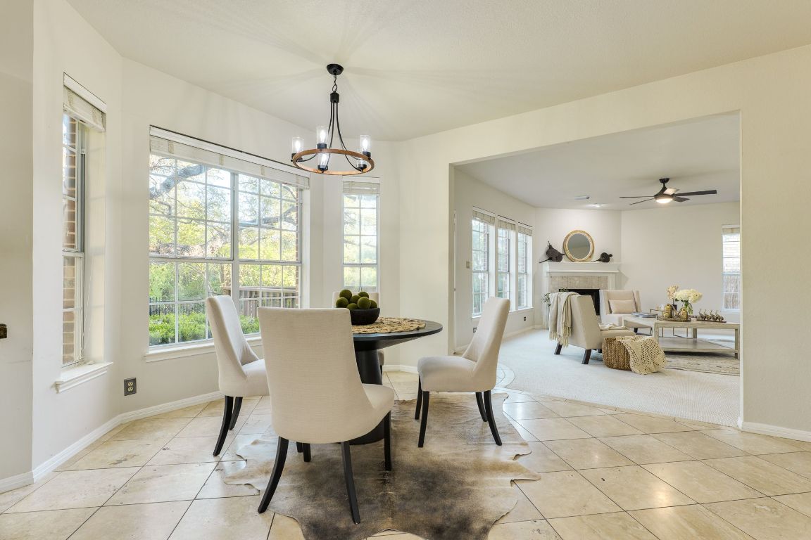 10701 Redmond Road Austin, TX 78739 - Photo 5 of 39 a view of a dining room with furniture window and outside view
