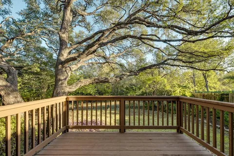 a view of balcony with wooden floor