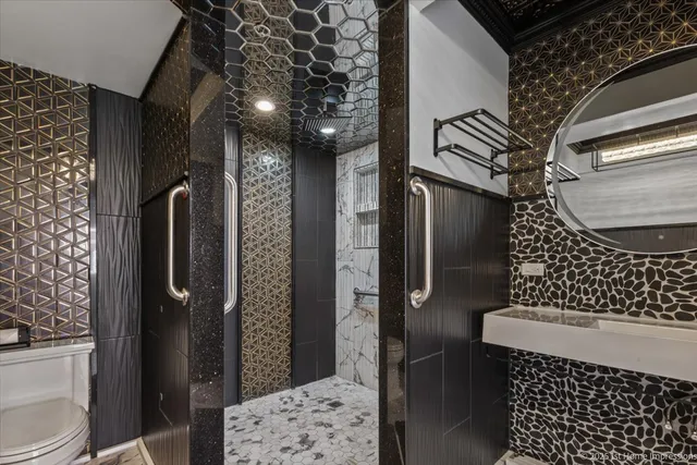 a bathroom with a toilet and a shower