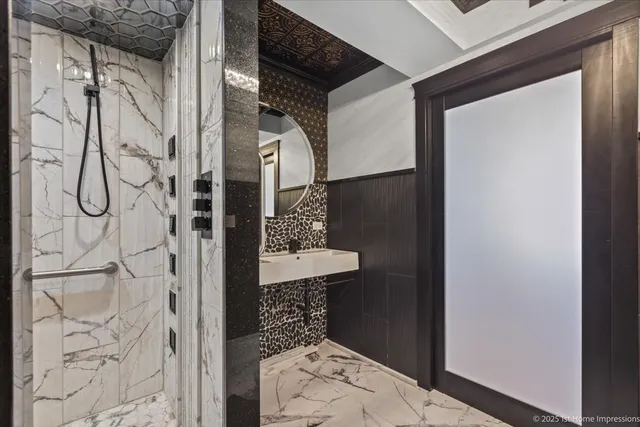 a bathroom with a shower and a sink