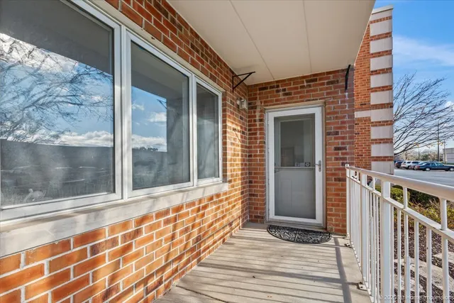 a view of a brick house with a large window