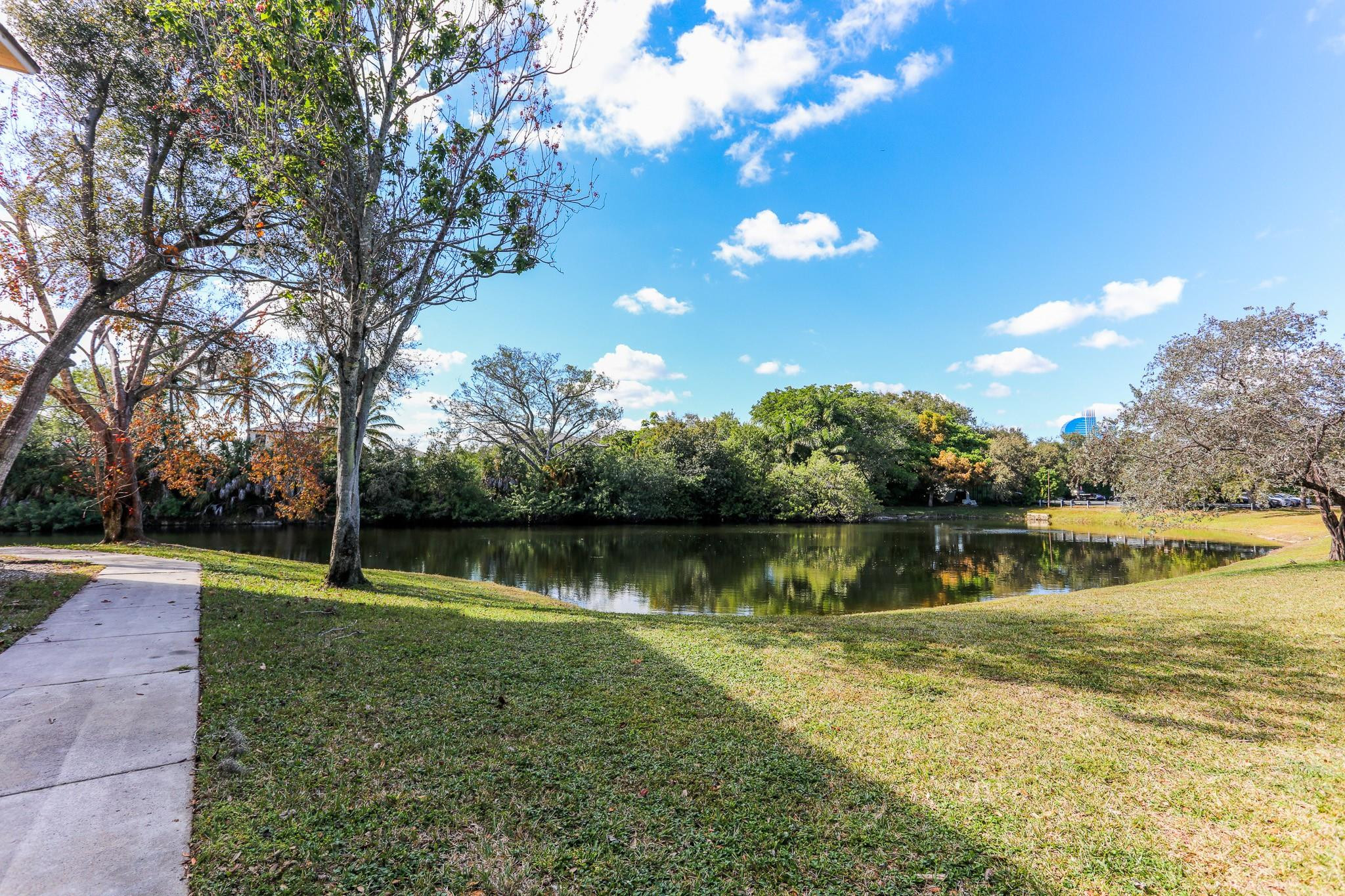3680 North 56th Avenue, Unit 806 Hollywood, FL 33021 - Photo 19 of 30 a view of a lake with houses in the background