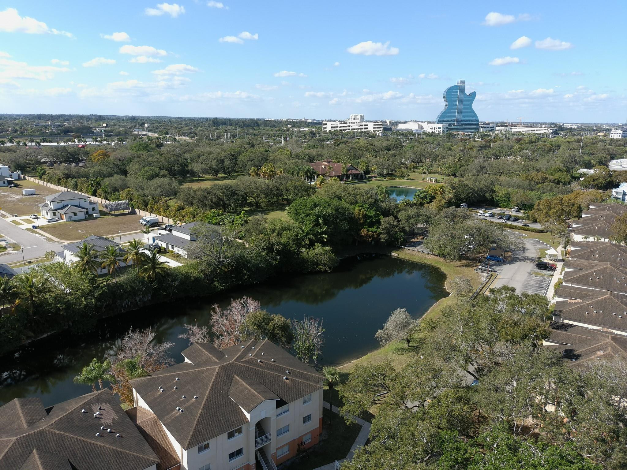 3680 North 56th Avenue, Unit 806 Hollywood, FL 33021 - Photo 29 of 30 an aerial view of a house with a yard and lake view