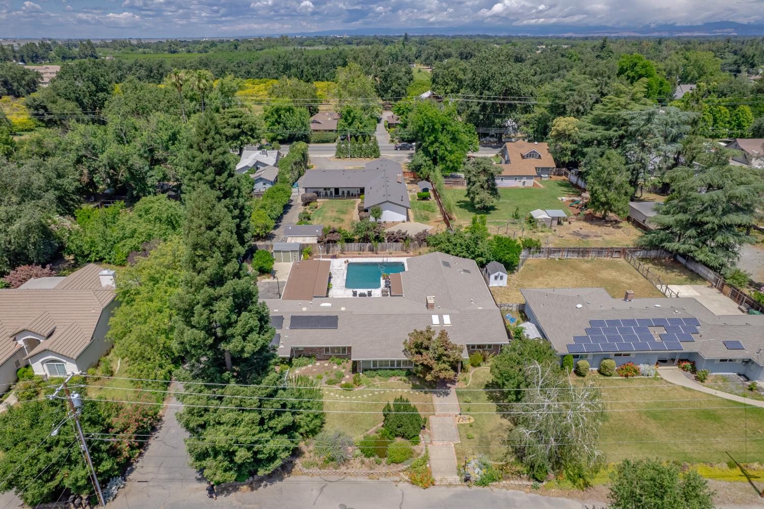 1880 Magnolia Street Gridley, CA 95948 - Photo 74 of 95 an aerial view of residential houses with outdoor space and trees
