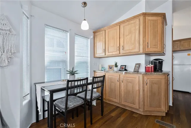 a kitchen that has a cabinets counter space and a window