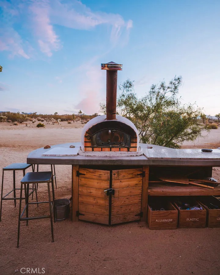 3535 Olympic Road Joshua Tree, CA 92252 - Photo 12 of 63 a roof deck with table and chairs