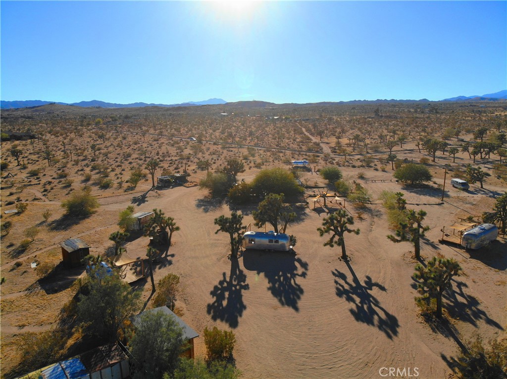 3535 Olympic Road Joshua Tree, CA 92252 - Photo 24 of 63 an aerial view of houses covered in trees