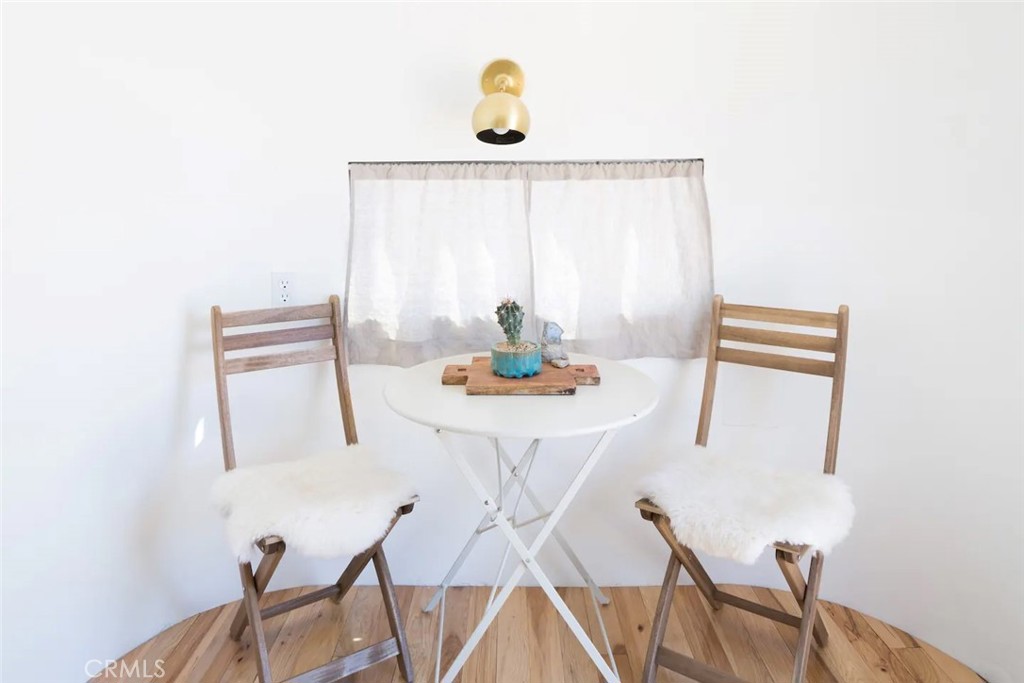3535 Olympic Road Joshua Tree, CA 92252 - Photo 32 of 63 a dining room with table and chairs