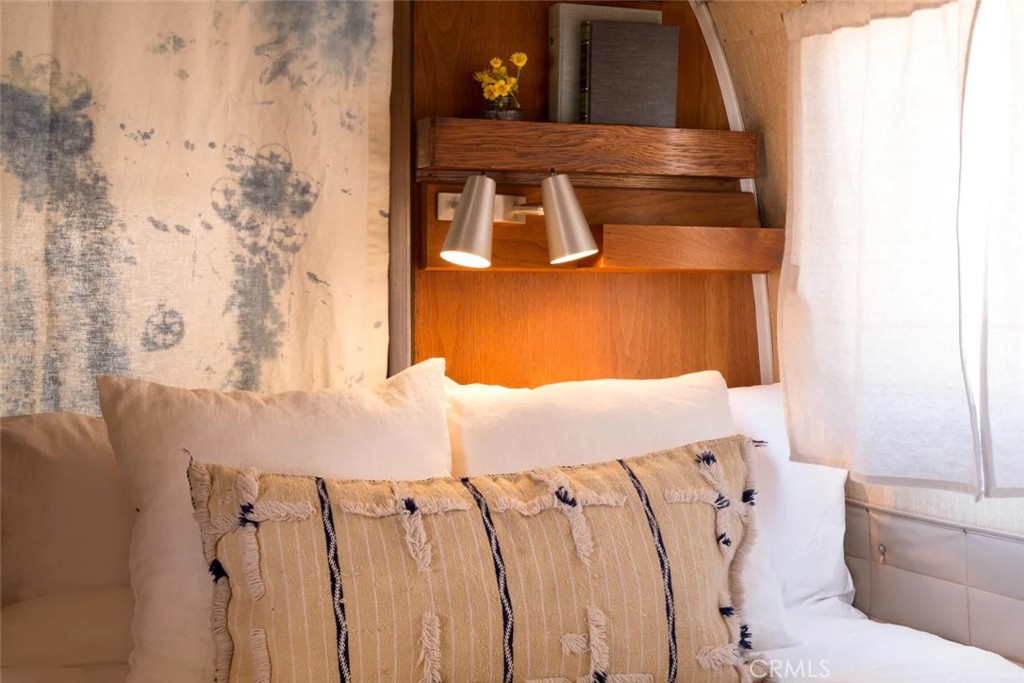 3535 Olympic Road Joshua Tree, CA 92252 - Photo 49 of 63 a bedroom with a bed and a couch