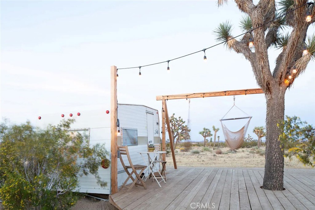 3535 Olympic Road Joshua Tree, CA 92252 - Photo 51 of 63 a view of a terrace with furniture