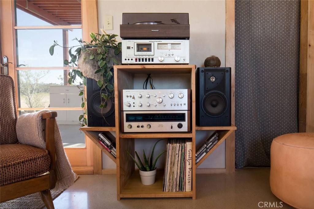 3535 Olympic Road Joshua Tree, CA 92252 - Photo 6 of 63 a living room with furniture and a fireplace