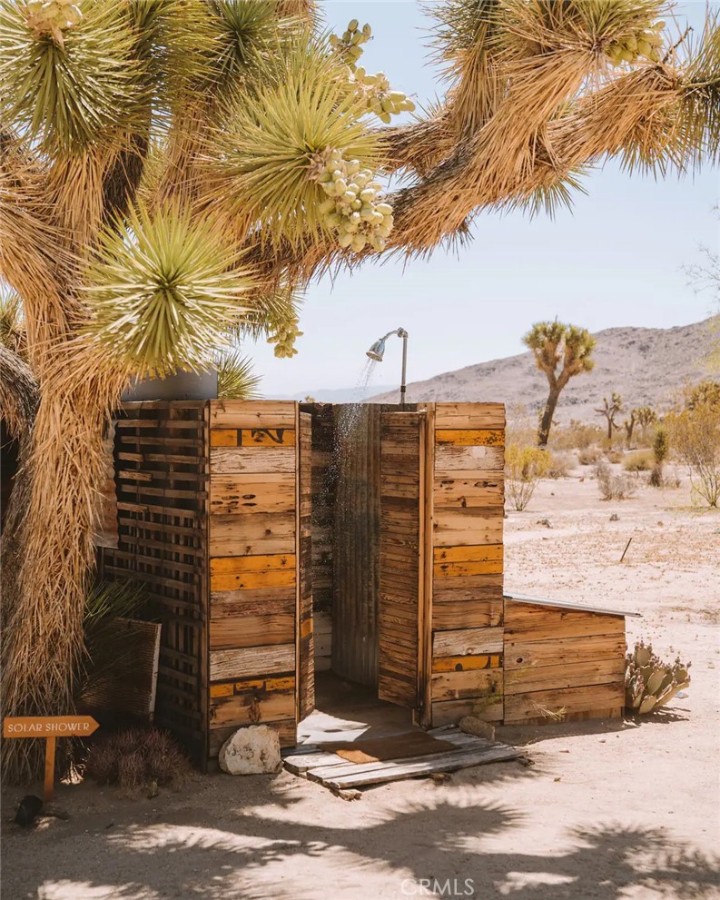3535 Olympic Road Joshua Tree, CA 92252 - Photo 61 of 63 a view of a terrace with a garden