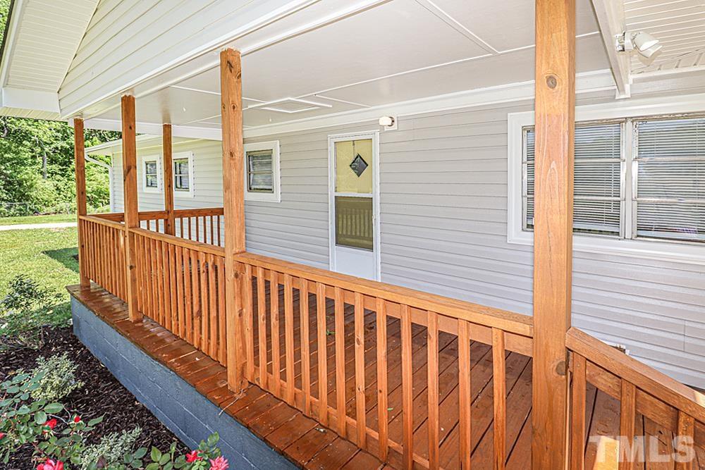 7995 Spencer Cockrell Road Rocky Mount, NC 27803 - Photo 16 of 17 Freshly stained front porch! New landscaping!