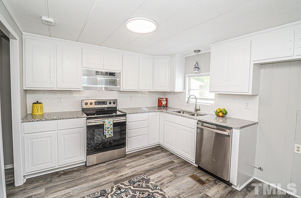 7995 Spencer Cockrell Road Rocky Mount, NC 27803 - Photo 3 of 17 Granite counters and STAINLESS appliances!