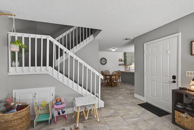 a dining room with a table and chairs