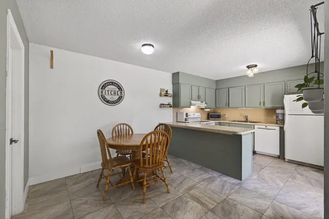 a view of room with furniture and wooden floor