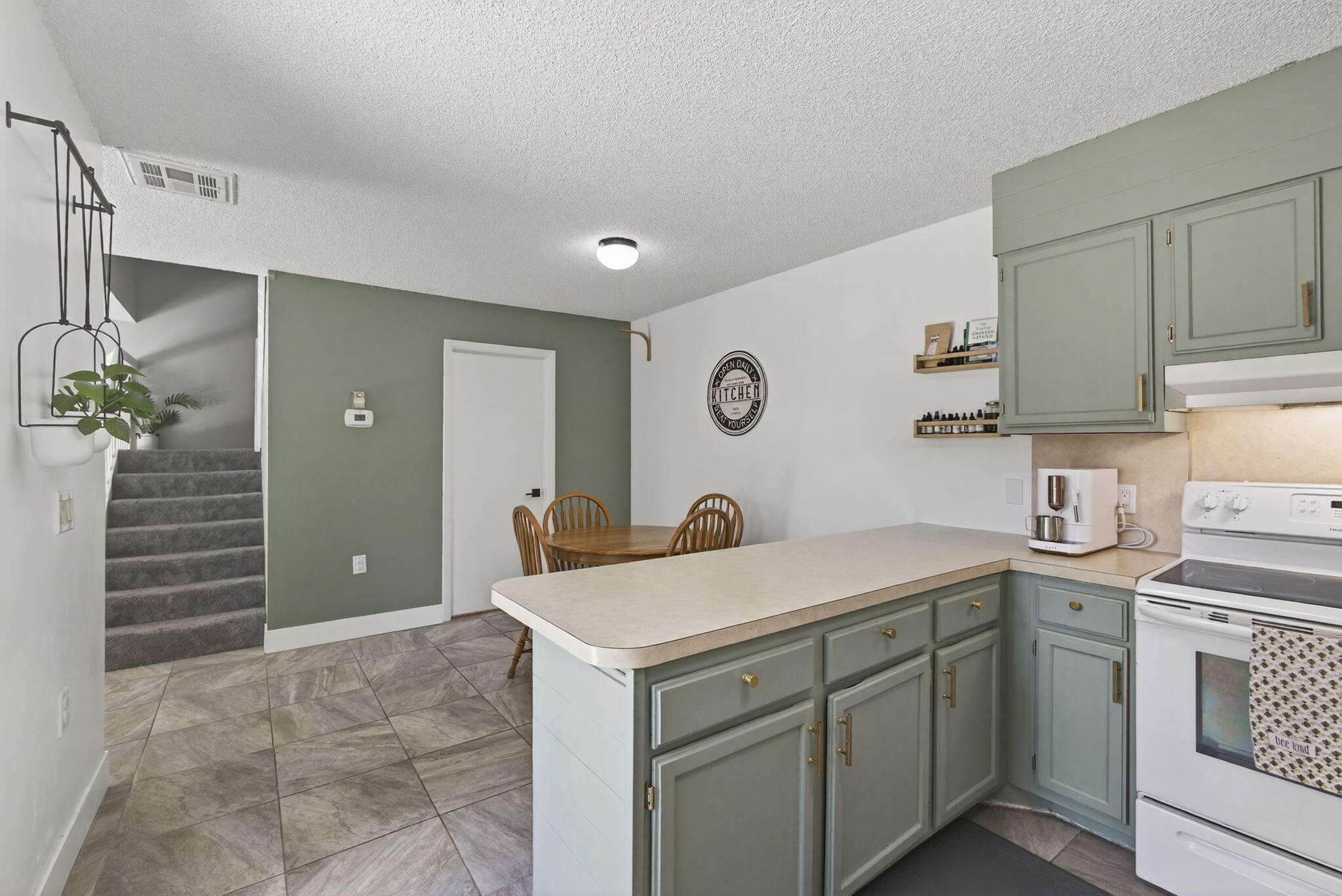 5680 Southeast Windsong Lane, Unit 345 Stuart, FL 34997 - Photo 18 of 54 a utility room with sink dryer and washer