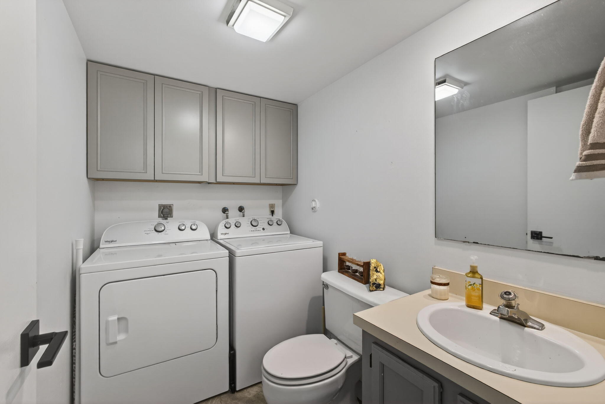5680 Southeast Windsong Lane, Unit 345 Stuart, FL 34997 - Photo 21 of 54 a view of bathroom with a sink and a toilet