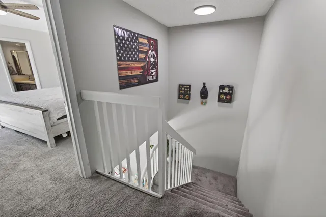 a bedroom with a bed and a tv