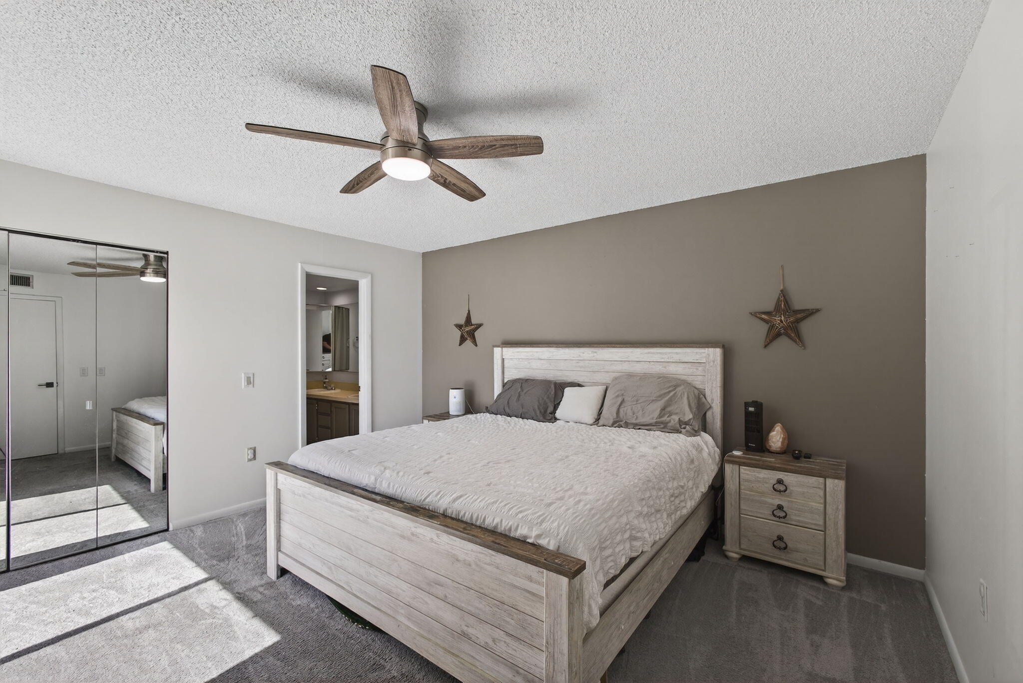 5680 Southeast Windsong Lane, Unit 345 Stuart, FL 34997 - Photo 24 of 54 a large white bed in a white room