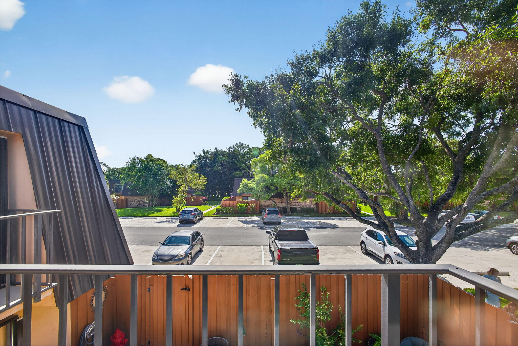5680 Southeast Windsong Lane, Unit 345 Stuart, FL 34997 - Photo 28 of 54 a view of a balcony with yard