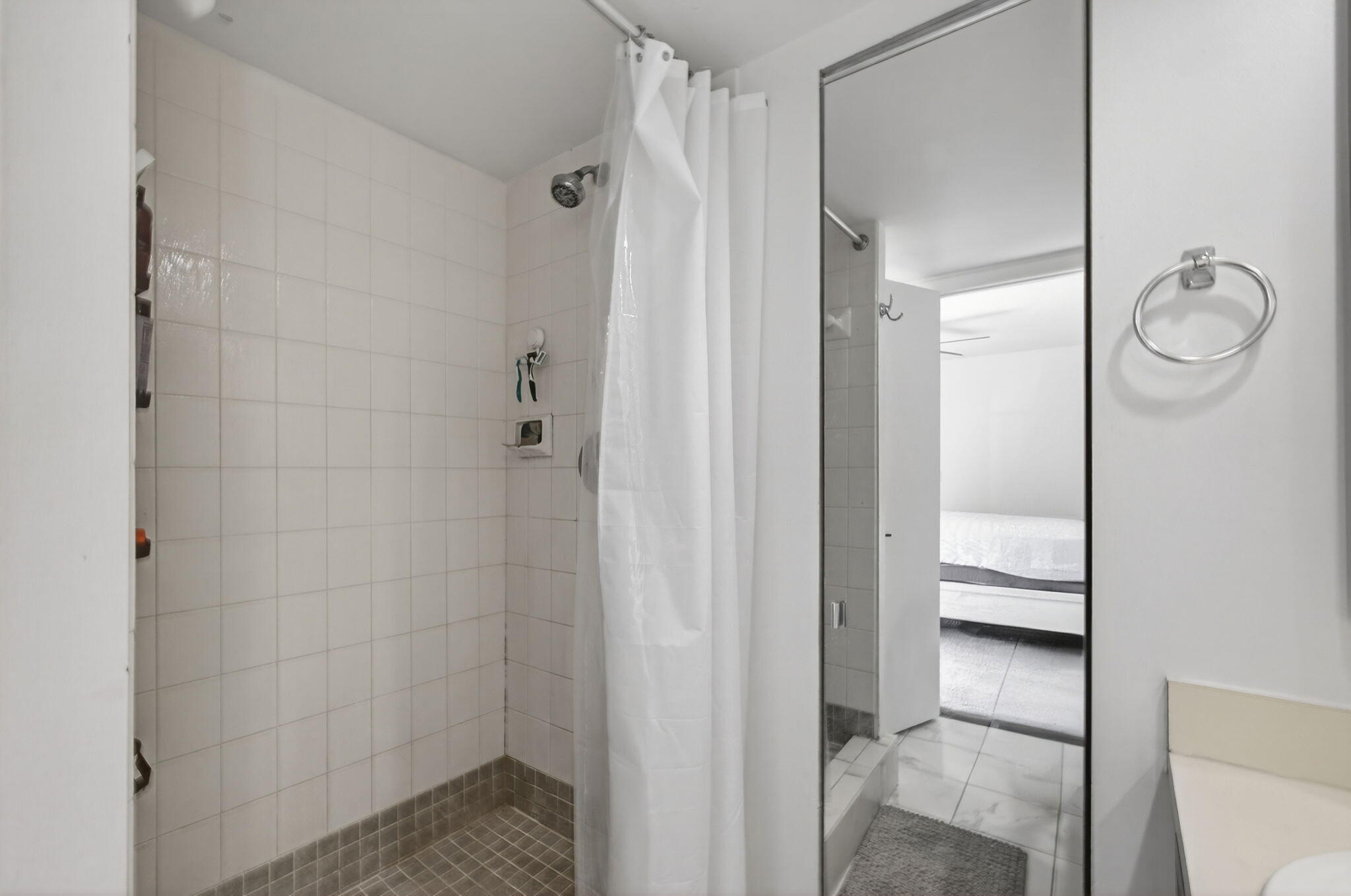 5680 Southeast Windsong Lane, Unit 345 Stuart, FL 34997 - Photo 31 of 54 a bathroom with a shower