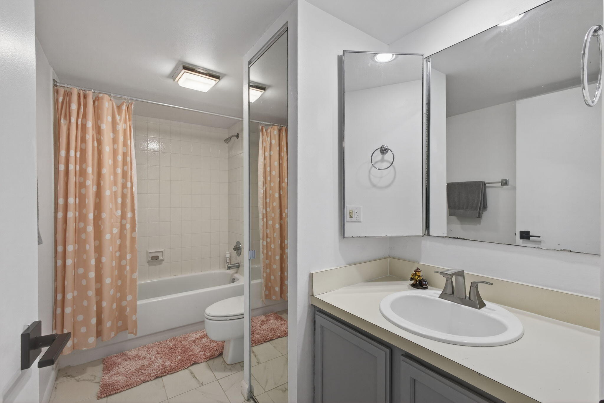 5680 Southeast Windsong Lane, Unit 345 Stuart, FL 34997 - Photo 35 of 54 a bathroom with a sink a toilet and shower