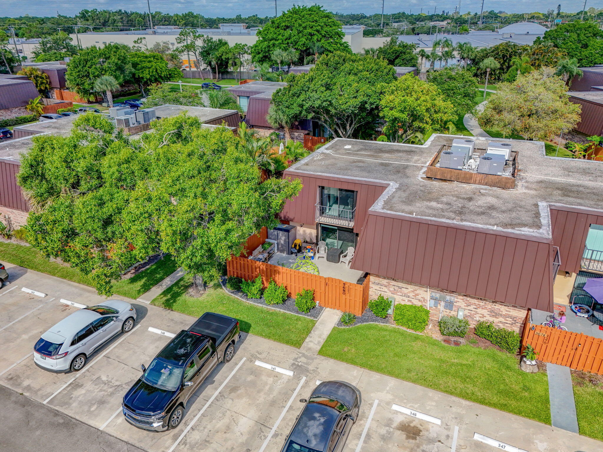 5680 Southeast Windsong Lane, Unit 345 Stuart, FL 34997 - Photo 40 of 54 an aerial view of a house with a yard