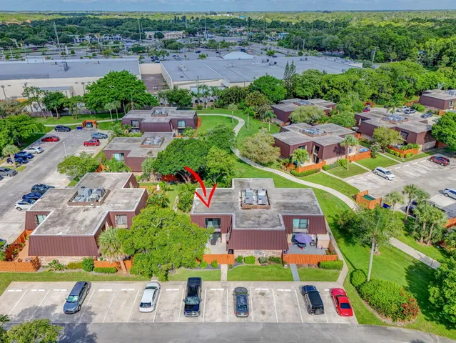 an aerial view of residential house with outdoor space and swimming pool