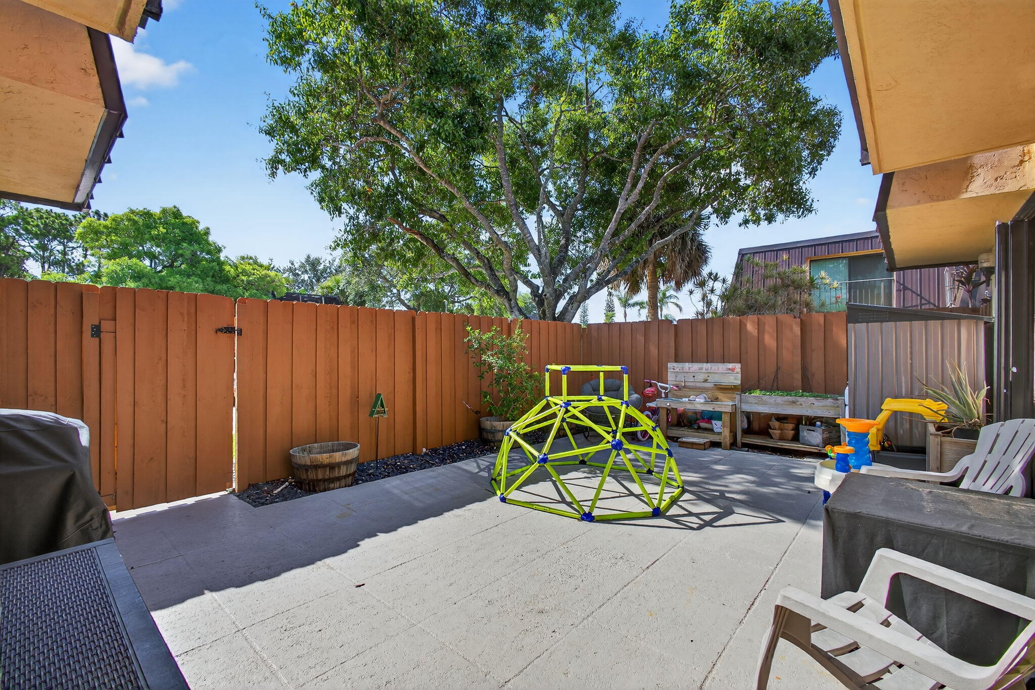 5680 Southeast Windsong Lane, Unit 345 Stuart, FL 34997 - Photo 5 of 54 a house view with a sitting space