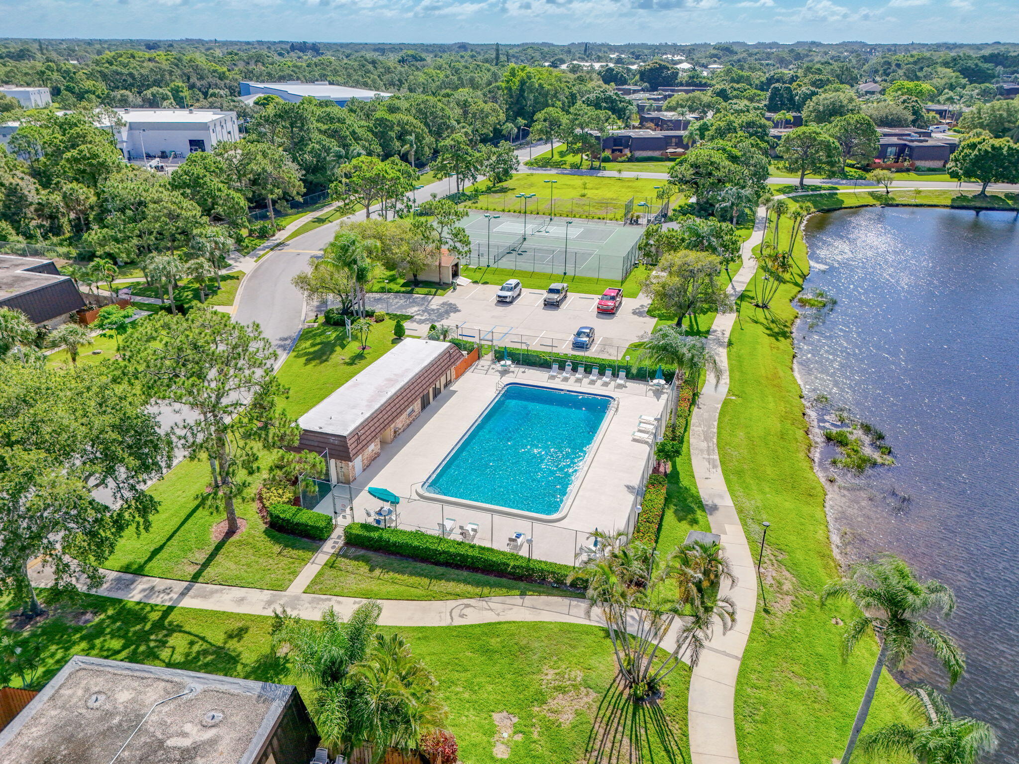 5680 Southeast Windsong Lane, Unit 345 Stuart, FL 34997 - Photo 52 of 54 an aerial view of a house with a swimming pool yard and outdoor seating