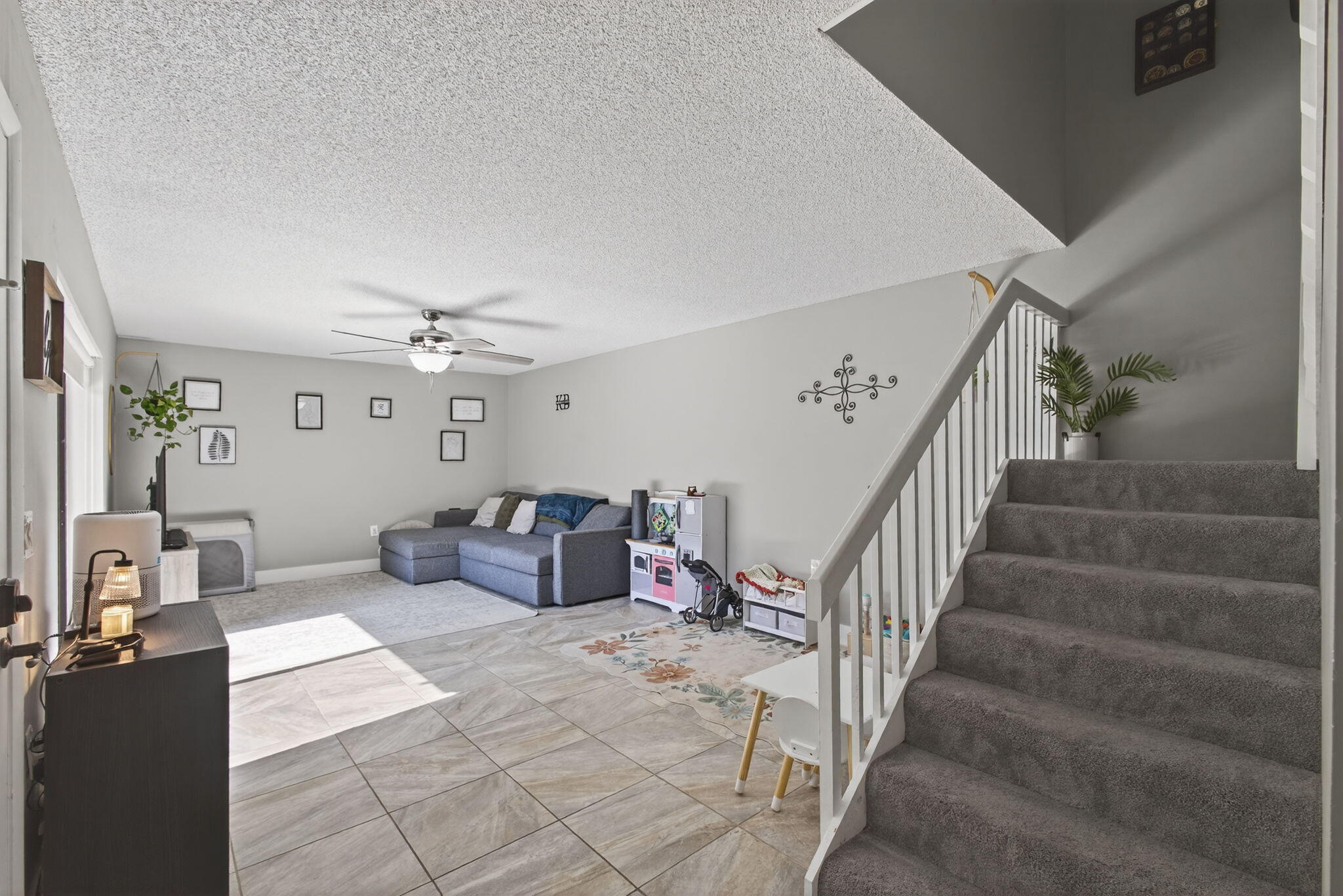 5680 Southeast Windsong Lane, Unit 345 Stuart, FL 34997 - Photo 7 of 54 a living room with furniture